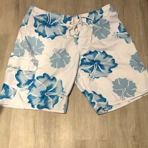 Hawaiian style swim trunks.